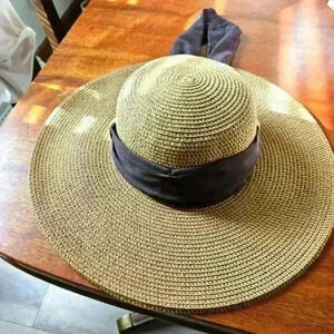Milani Sun hat. Brown & Black weave with Brown Fabric ribbon 🎀 around.